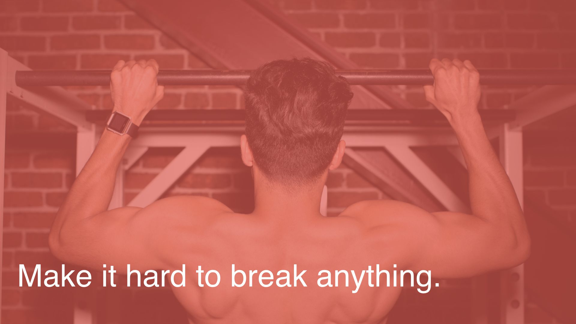 Background photo of a shirtless, moderately buff man doing a pullup. Text overlaid: Make it hard to break anything.